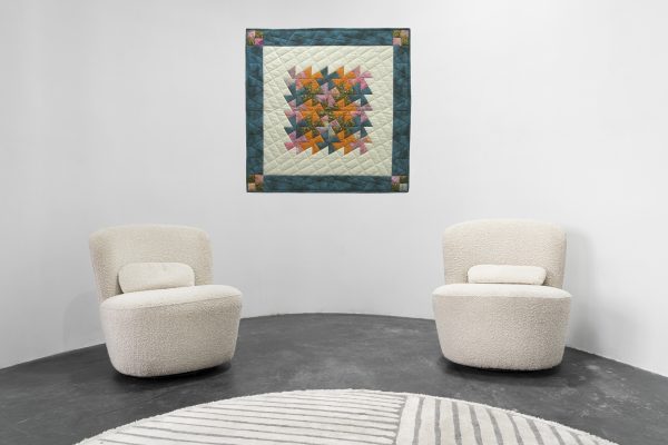 JUDD Jean Fiesta Pinwheels (River Eddy #1) shown in a waiting room interior setting.